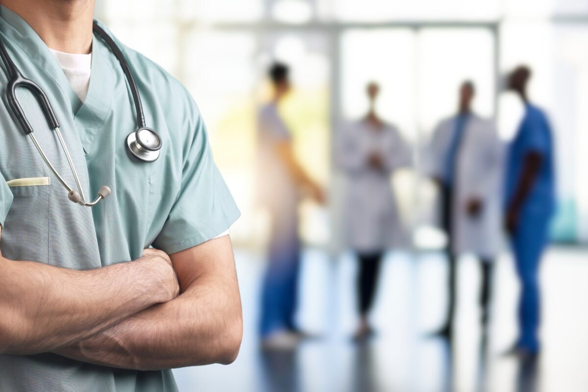 A,Close-up,Of,A,Healthcare,Professional,In,Scrubs,With,Arms A,Close-up,Of,A,Healthcare,Professional,In,Scrubs,With,Arms