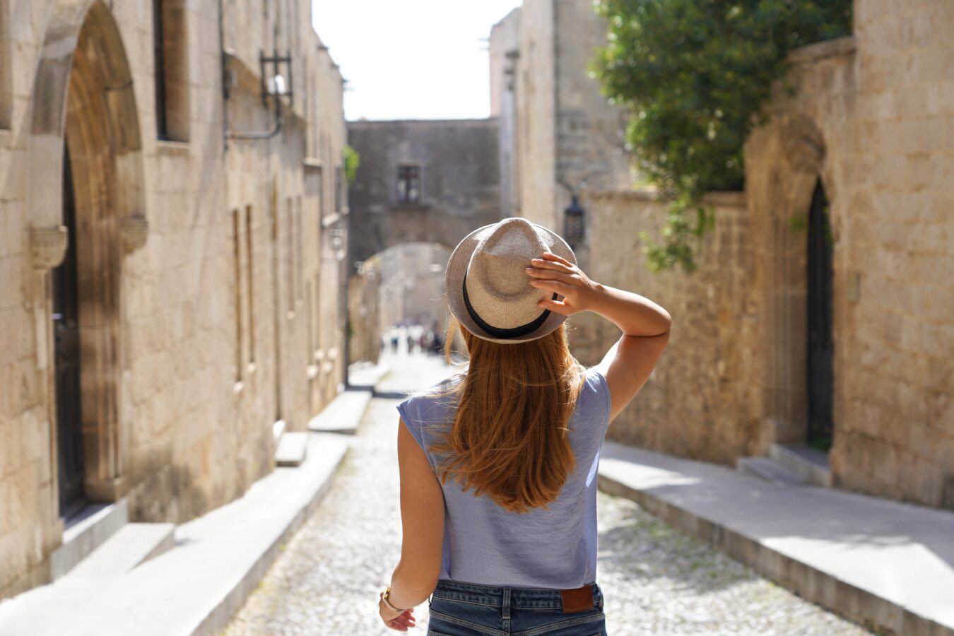 Tourist discovering what Rhodes is known for, starting with the old town.